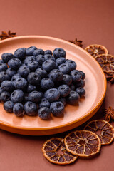 Fresh juicy blueberries, healthy vegan food with vitamins and minerals. Blueberries berry