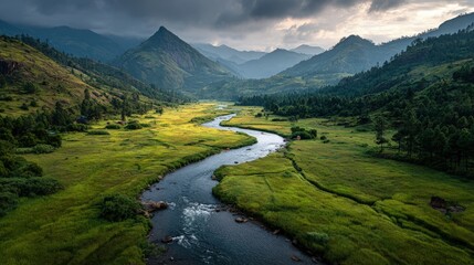 A serene river winds through a lush green valley scenic landscape with misty mountains in the distance golden sunrise