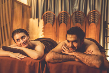 Caucasian couple customer enjoying relaxing anti-stress spa massage and pampering with beauty skin...