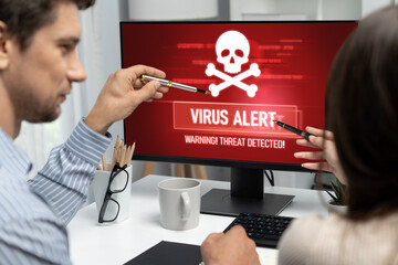Virus warning alert on computer screen detected brisk cyber threat , hacker, computer virus and...