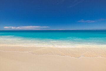 Beautiful tranquil sunny beach with soft sand, calm sea, and clear blue sky peaceful Mediterranean coastline perfect for beauty summer vacation, tourism, nature scenery and travel background wallpaper