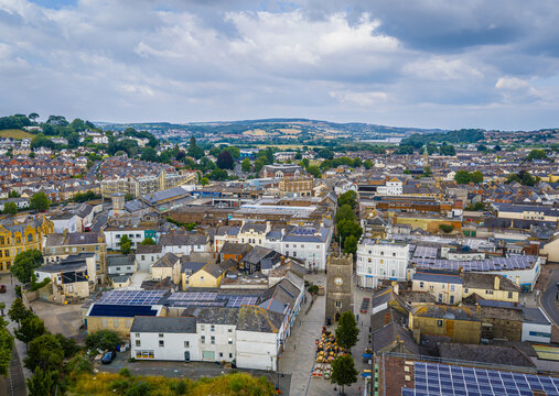 Aerial view of Newton Abbot&rsquo;s historic St Leonard&rsquo;s Tower (Clock Tower) rising above town centre pedestrian streets and shops