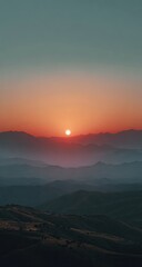 Obraz premium Sunrise over misty mountain ranges (1)