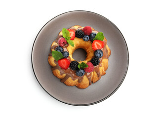 Tasty Bundt cake with berries, chocolate and mint isolated on white, top view