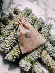 Sackcloth bag with dried sagebrush, medicinal herbs, scented dried herbs, herbal medicine,...