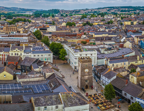 Aerial view of Newton Abbot&rsquo;s historic St Leonard&rsquo;s Tower (Clock Tower) rising above town centre pedestrian streets and shops