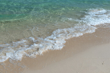 Turquoise colored ocean and sandy beach in Semporna, Sabah Borneo, Malaysia