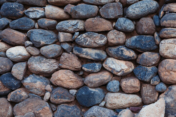 Old stones from a traditional house in Oman, built with ancient Islamic architectural techniques,...