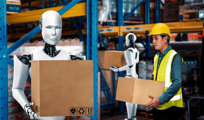Innovative industry robot working in warehouse together with human worker . Concept of artificial intelligence for industrial revolution and automation manufacturing process .