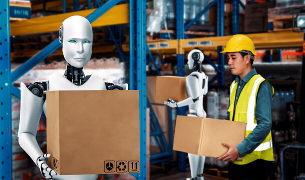 Innovative industry robot working in warehouse together with human worker . Concept of artificial intelligence for industrial revolution and automation manufacturing process .