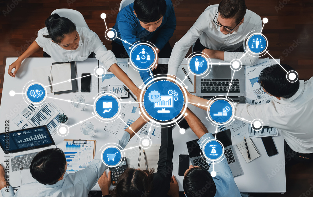 Poster a dynamic business meeting featuring professionals collaborating over data analytics and erp strateg