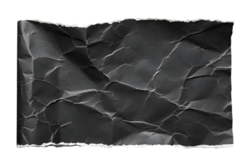 An isolated transparent png image of crumpled black paper features torn edges and a deeply wrinkled surface.