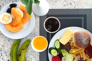 Fruit and vegetable breakfast with coffee on the table. Top view