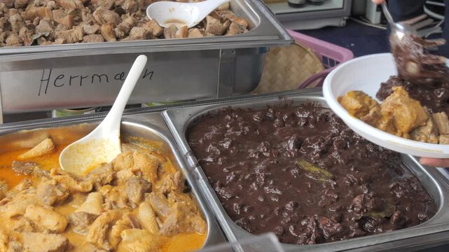 Filipino Delicacies: Traditional Curry and Dinuguan at the Food Fest