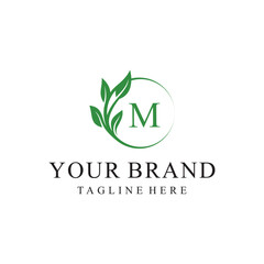 Initial letter M green leaves organic natural logo design, cosmetics and beauty vector icon concept