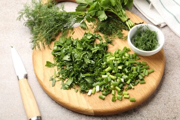 Different fresh herbs and knife on grey table, closeup