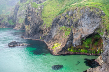 Carrick-a-Rede Rope Bridge is a famous rope bridge near Ballintoy in County Antrim, Northern...