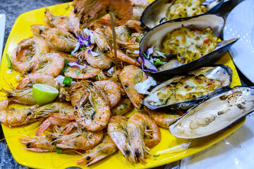 Prepared shrimps and oysters on the plate