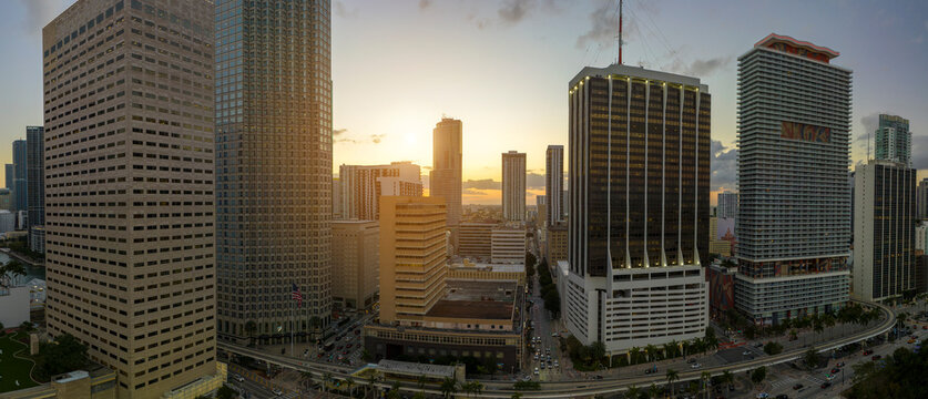 Evening urban landscape of downtown district of Miami Brickell in Florida, USA. Skyline with high skyscraper buildings and urban transportation system in modern american megapolis - Powered by Adobe