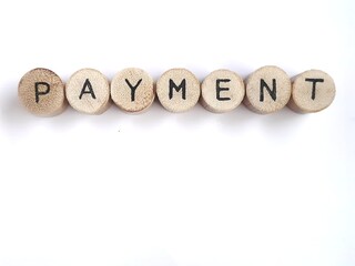  Payment - round wooden pieces with letters, sign with round wooden pieces on white background