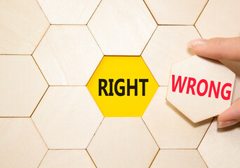 Right or Wrong symbol. Concept word Right or Wrong on wooden comb puzzle. Businessman hand....