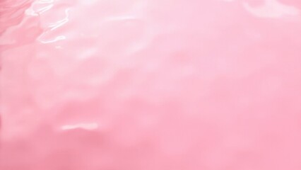 Gentle pink liquid Gentle pink liquid with soft waves and highlights. Concept of beauty and tranquility.