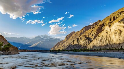 Scenic view of the Indus River, a historic waterway flowing through Pakistan and India, featuring calm waters, fertile riverbanks, traditional boats, rural villages, and lush vegetation