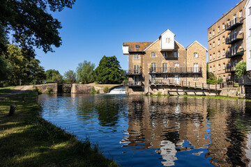 Historic coxes Lock and flour mill on the River Wey Navigations in Addlestone, Surrey