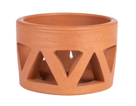 Rustic terracotta planter with geometric cutouts adds natural charm to any home decor setting