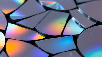 Shattered Data: A mesmerizing close-up shot reveals the intricate patterns and radiant colors of a collection of shattered compact discs, transforming digital remnants into abstract art. 
