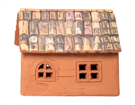 Charming rustic clay house model with weathered tile roof evokes cozy charm and timeless appeal.