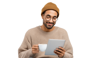 Smiling Indian Man with a Beanie and Glasses Using a Tablet and Holding a Coffee Mug. Ideal for themes of casual remote work, freelancing, online learning, or digital lifestyle in tech blogs