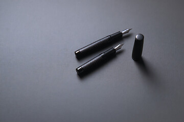 Naklejka premium pen on a black background