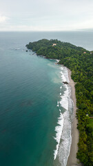 Vertical landscape shot of Manuel Antonio beach in Costa Rica on a sunny morning overlooking the peninsula