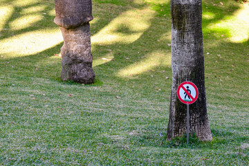 Stay off the grass sign in a public garden, Monte-Carlo, Principality of Monaco