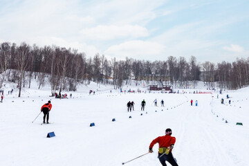 Group of people skiing activity  in snowy cold winter trail landscape