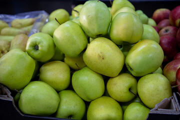 Many ripe red, green apples. Sale of apples at the market and store. Background. Top view. Concept sale at the market and store. Farm products.