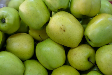 Many ripe red, green apples. Sale of apples at the market and store. Background. Top view. Concept sale at the market and store. Farm products.
