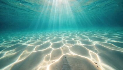 Naklejka premium Sunlight streams through clear turquoise ocean water, illuminating sandy seabed patterns. Aquatic scene shows shallow waves rippling over sand. Tropical paradise offers serene, peaceful summer