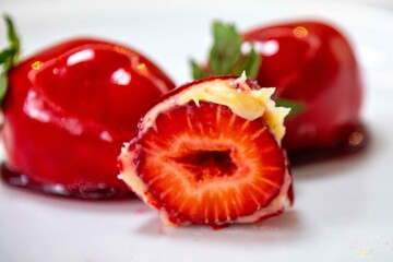 The iconic and delicious Brazilian strawberry of love, prepared with fresh strawberries, white brigadeiro and crunchy caramel on the surface. Morango do amor