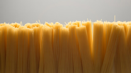 Close-up of strands of light yellow pasta.
