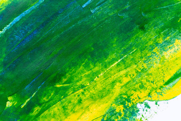 緑と黄色の絵具で塗った背景	