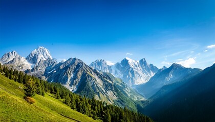 a mountain range with a blue sky and trees