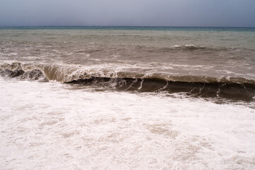 Storm on the Black Sea in winter, dark cloudy sky, seascape.