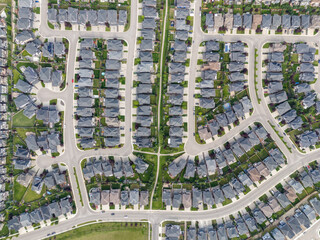 View of homes during the summer in Aspen Estates area of Calgary, Alberta.