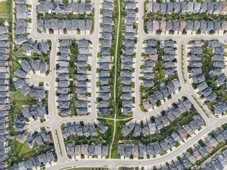 View of homes during the summer in Aspen Estates area of Calgary, Alberta.