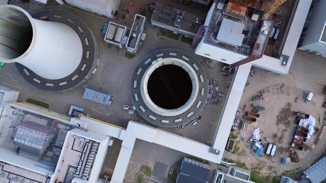 dismantling power plant demolition process. Dramatic aerial view flight drone