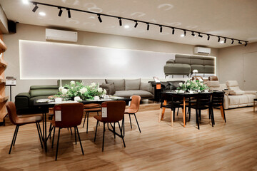 Furniture dining table and chairs and sofa with floral decoration, aesthetic minimalist interior design, and dim lighting
