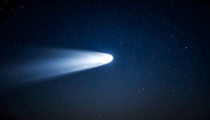Bright comet streaks across night sky