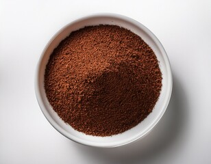ground coffee in a white bowl on a white background